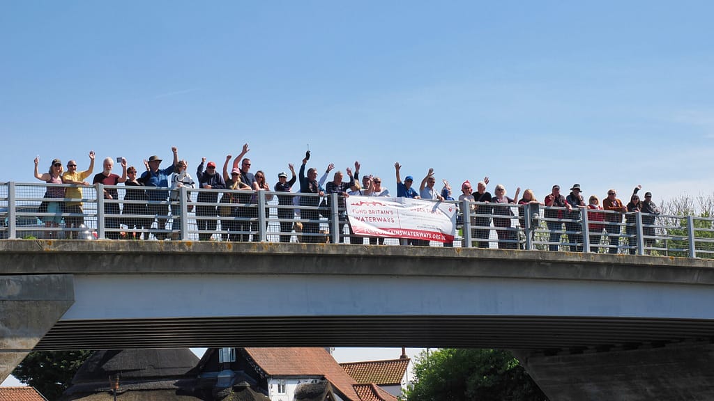 Fund Britain's Waterways Weekend of Action supporters on a bridge
