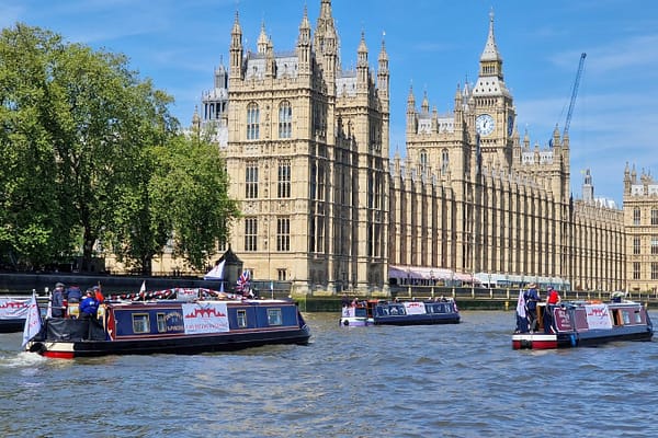 Campaign boats cruising near Westminster